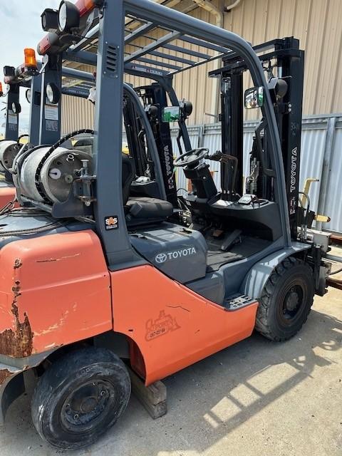 Two 2012 Toyota Forklifts 8FGU25 with drum dumper attachments 